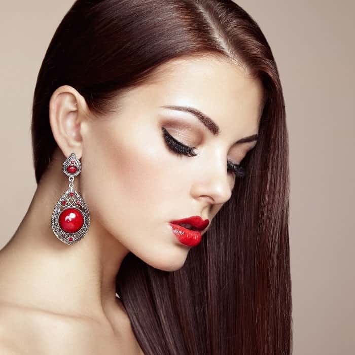 portrait of beautiful brunette woman with earring 2021 08 26 17 05 07 utc min